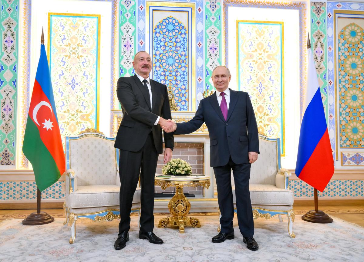 Azerbaijani President Ilham Aliyev shakes hands with Vladimir Putin at the Central Asia-Russia summit, in Dushanbe, Tajikistan, 9 October 2025. EPA / GRIGORY SYSOEV / SPUTNIK / KREMLIN